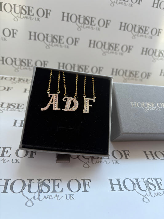 Gold initial pendant on chain